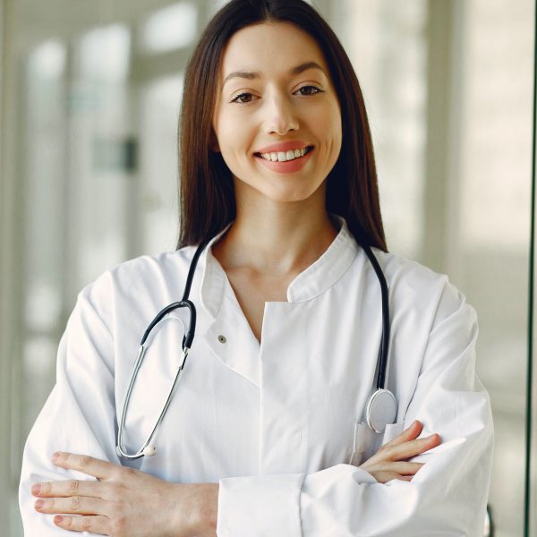 Woman doctor crossing arms smiling